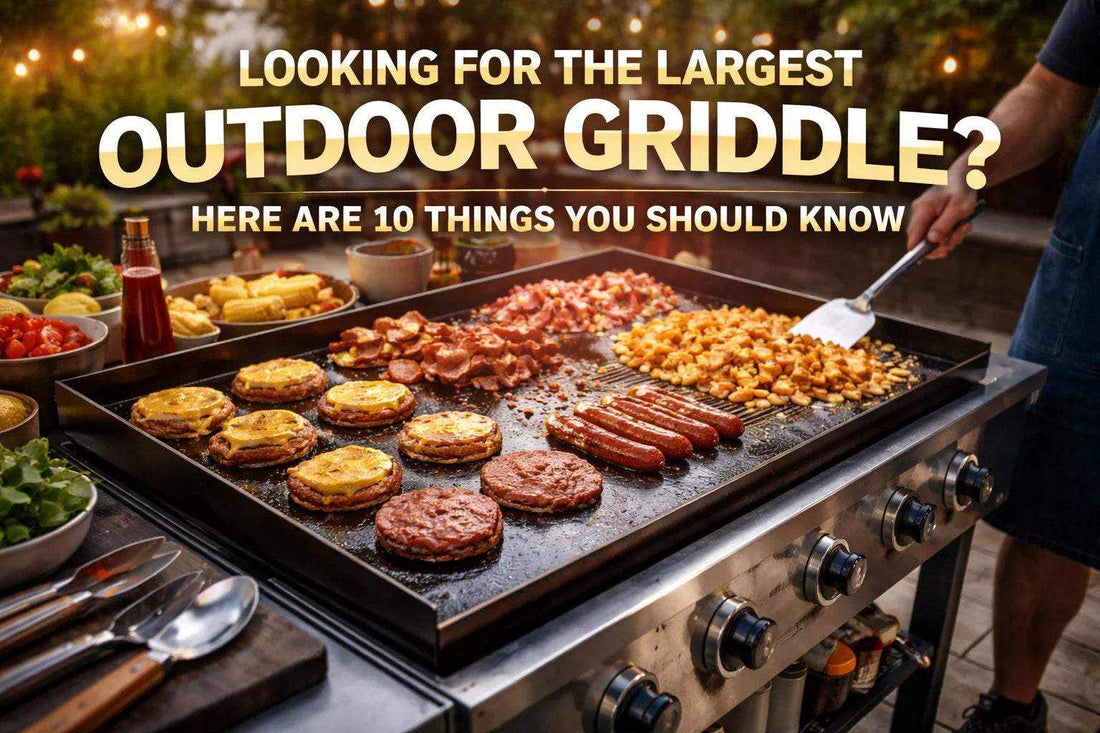Find the Largest Outdoor Griddle showing a large black griddle cooking burgers, sausages, bacon, eggs and pancakes