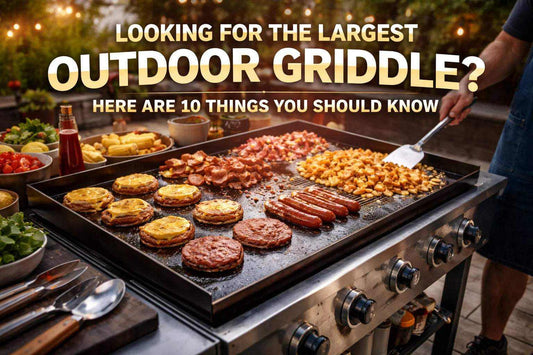 Find the Largest Outdoor Griddle showing a large black griddle cooking burgers, sausages, bacon, eggs and pancakes